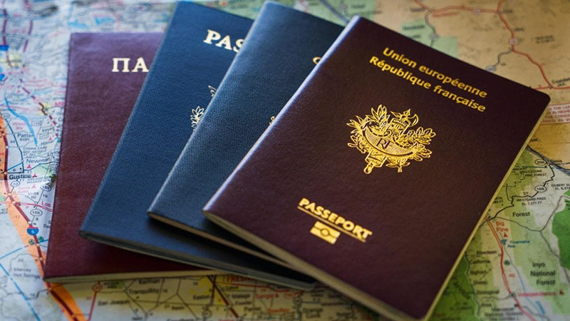 101182417_F5F46N_A_selection_of_international_passports_sitting_on_a_mapxlarge_trans_NvBQzQNjv4Bqek9vKm18v_rkIPH9w2GMNpPHkRvugymKLtqq96r_VP8