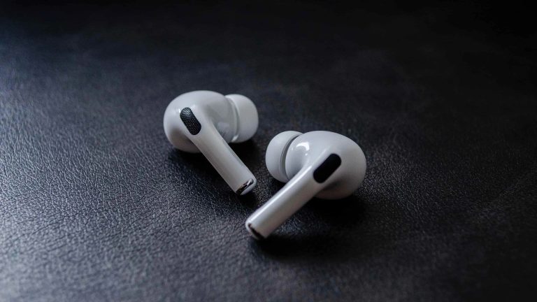 airpods-pro-first-generation-model-year-2019-earbuds-black-leather-table-cover-1