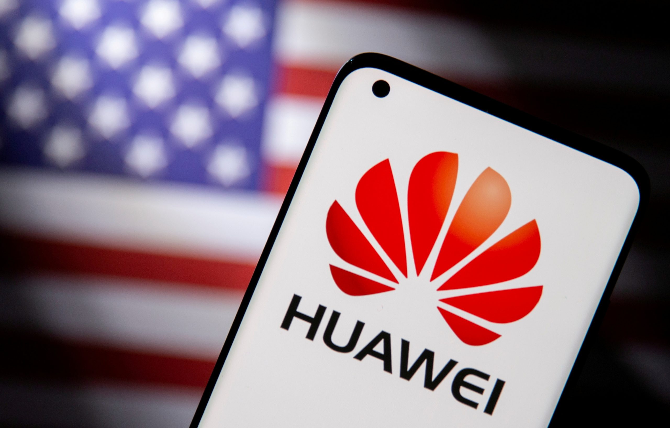 FILE PHOTO: Smartphone with a Huawei logo is seen in front of U.S. flag in this illustration
